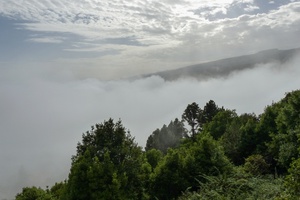 On top of a hill over the clouds